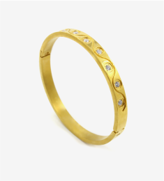 Gold bangle with engraved circles